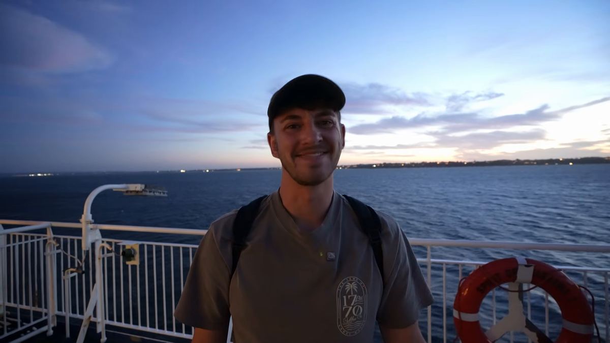 Luke on deck at sunset, looking out over the water